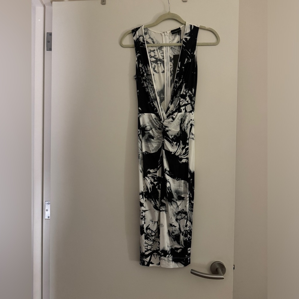 John Richmond black & white dress. Low cut  V front, form fitting. Size 4. New.